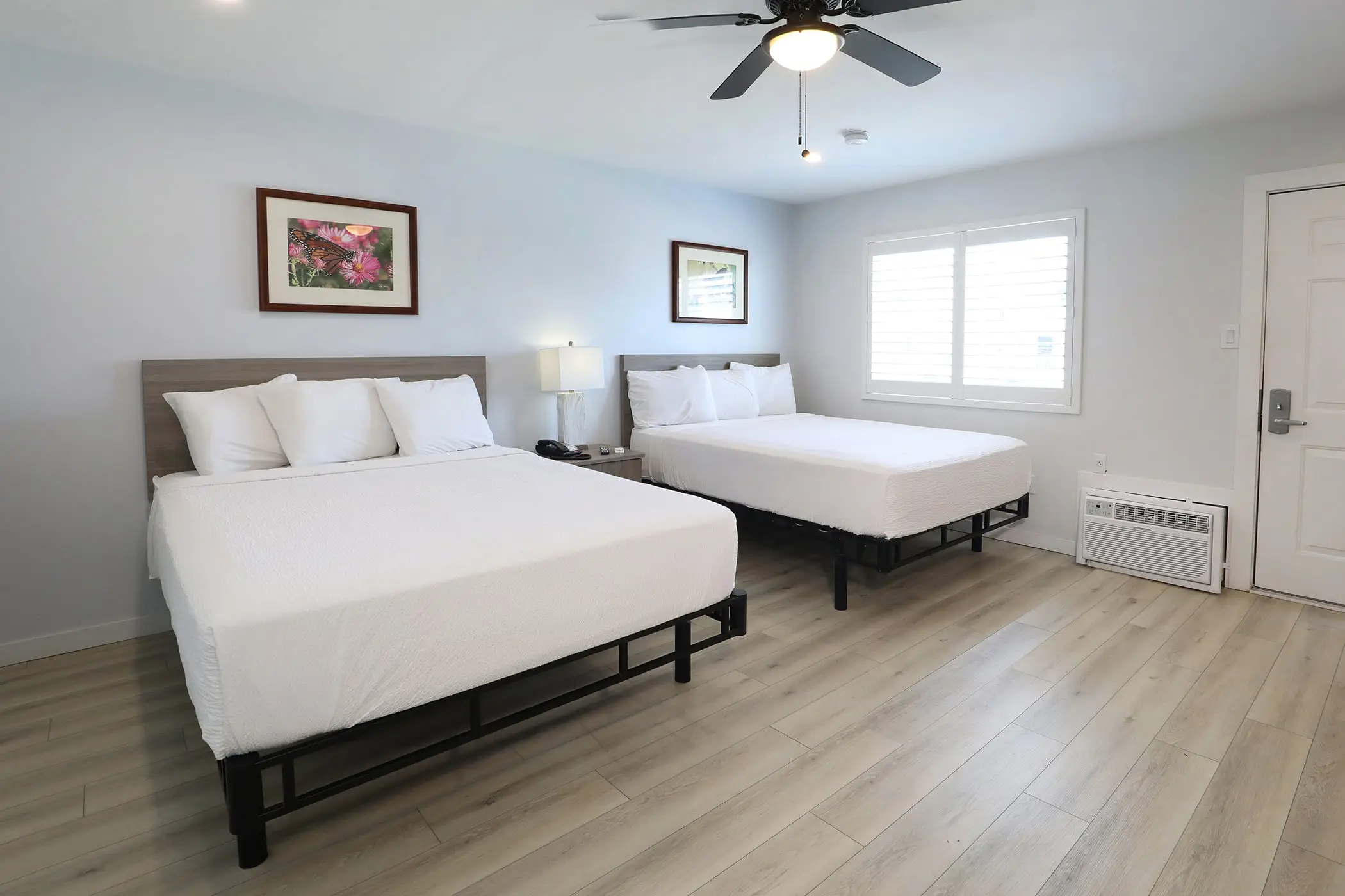A Type 10 Townhouse Motel Room at the Matador, with two queen beds, a ceiling fan and a window